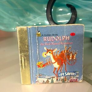 Vintage lifesaver, golden book Rudolph, the red nose, reindeer number one